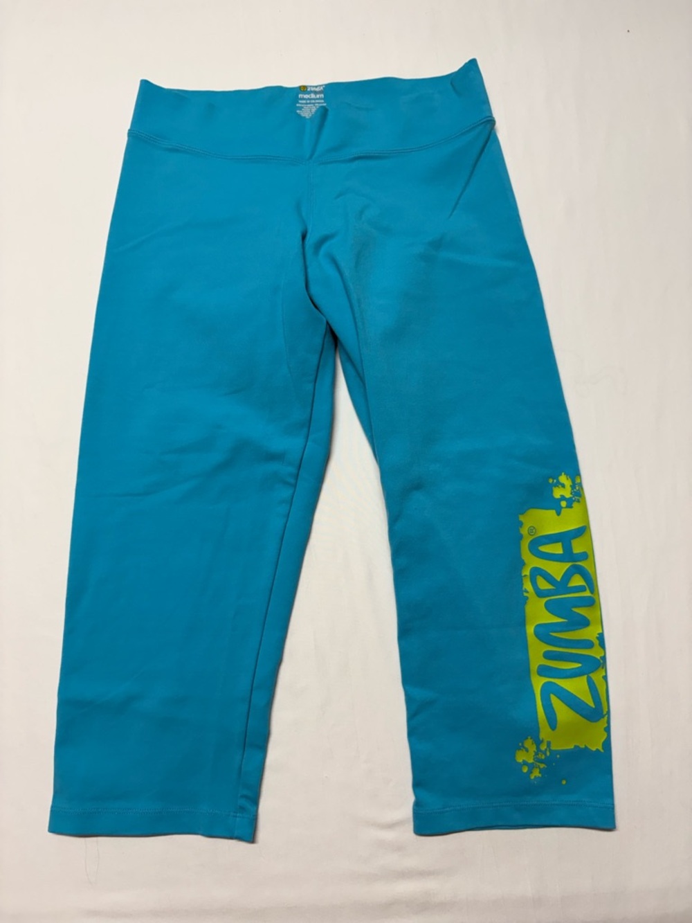 Zumba Fitness Teal Capri Leggings with Yellow Logo Accent